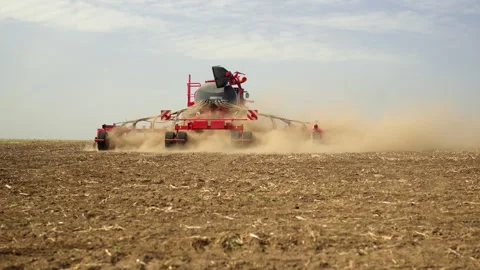 Wide Angle of Modern Tractor Towing Precision Air Seeder Sowing Crops Stock Footage 305383466