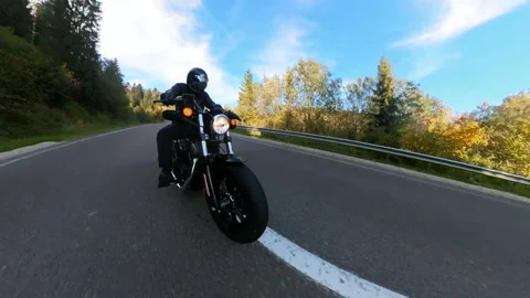 Wide-angle motion footage of fast motorbike driver riding on highway country Stock Footage 167920036