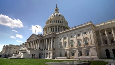 Wide angle motion of the US Capitol in Washington, DC on a beautiful sunny day. Stock Footage 128332223
