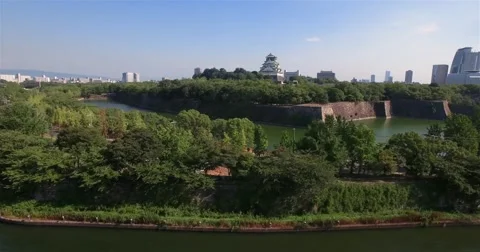 Wide angle moving aerial shot Osaka Castle park Attraction  Stock Footage 66074543