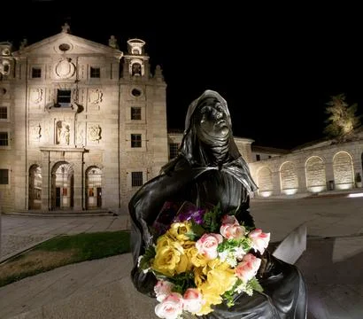 Wide angle night time image of the sculpture of St. Teresa with a colorful Stock Photos