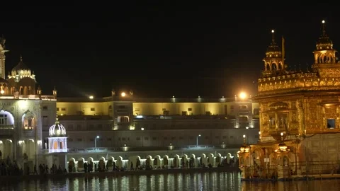 Wide Angle Night View of Golden Temple Illuminated in Amritsar Stock Footage 331341183