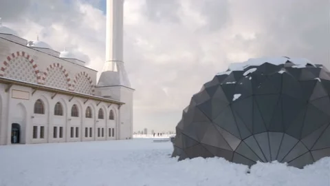 Wide Angle Pan Shot Of Great Camlica Mosque's Courtyard Covered With Snow Stock Footage 168929034