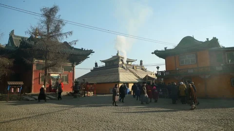 Wide Angle of People Walking Through Plaza as Others Wait in Line for a Building Stock Footage 115705038