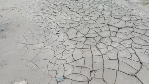 Wide Angle Perspective View of Dry Cracked Clay Mud and Drought Soil Pattern Stock Photos