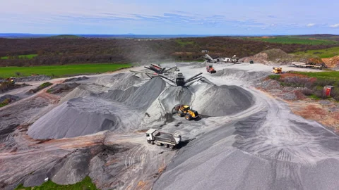 Wide angle of quarry crushing operation with loader and dump truck, Bulgaria Stock-Footage 345151217