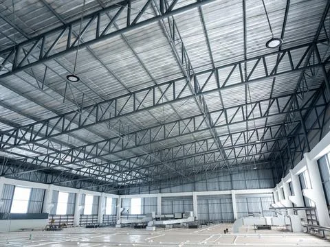 Wide angle scene of warehouse construction buildings roof structure with wi.. Stock Photos