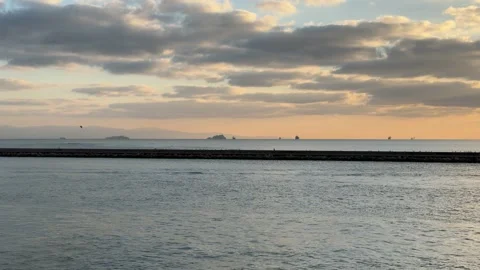 Wide angle scenic view of the calm Marmara Sea, breakwater, and golden Stock Footage 340155047