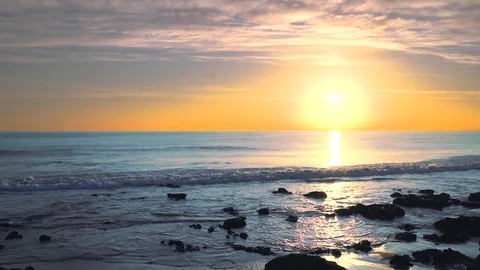 Wide angle seascape view looking straight into the sun at sunset, Stock Footage 108937147