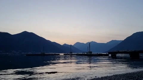 Wide-angle seaview sunset with mountains and harbor Stock Footage 236918422