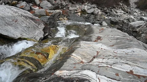 Wide angle of sedimentary rock with mountain waterfall in rocky stream Video stock 234734603