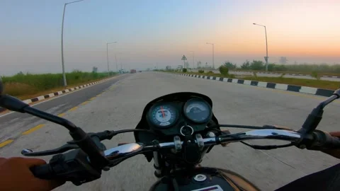 A wide angle Shoot on a motorcyclist Riding 動画素材 146149624