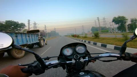 A wide angle Shoot on a motorcyclist Riding Stock Footage 146149751