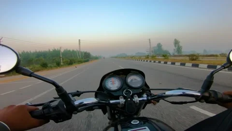A wide angle Shoot on a motorcyclist Riding 動画素材 146149776