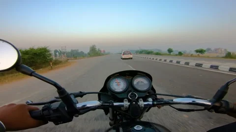 A wide angle Shoot on a motorcyclist Riding Stock Footage 146150102