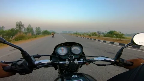 A wide angle Shoot on a motorcyclist Riding Vídeos de archivo 146150123