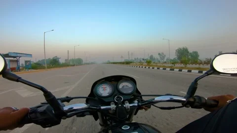 A wide angle Shoot on a motorcyclist Riding 库存影片 146150406