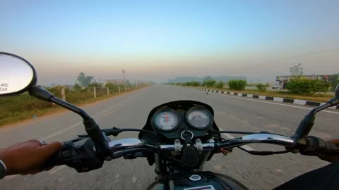 A wide angle Shoot on a motorcyclist Riding Видео 146150409