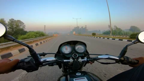A wide angle Shoot on a motorcyclist Riding Vidéo 146150600