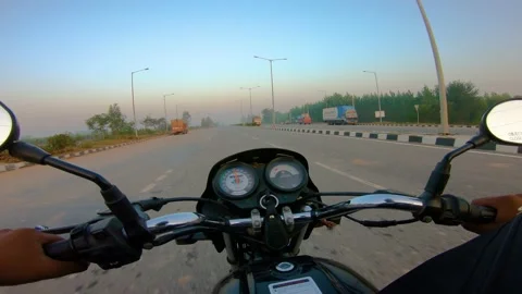 A wide angle Shoot on a motorcyclist Riding 動画素材 146150604