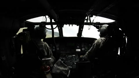 Wide angle shot from in Black Hawk helicopter of the pilots. Stock Footage 52701746