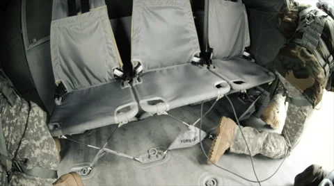 Wide angle shot from in Black Hawk helicopter of soldiers inside and cargo Stock Footage 52701747