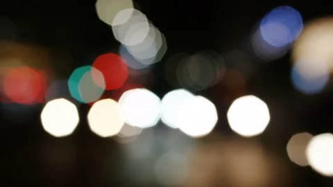 Wide angle shot of blurred traffic coming towards camera at night 库存影片 84008180