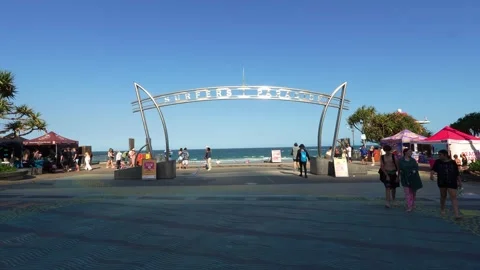 A wide-angle shot capturing the iconic Surfers Paradise archway entrance leads Stock Footage 325499546