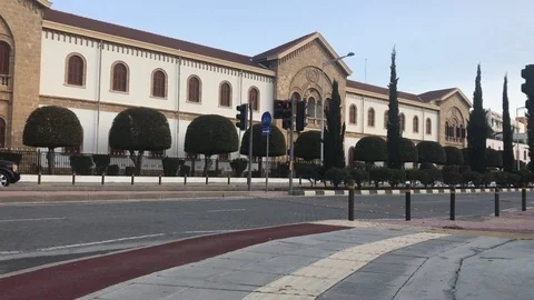 Wide Angle Shot of a Car Pass by Classic Building in Nicosia Stock Footage 101794080