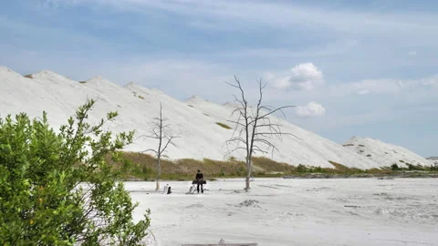 A wide-angle shot of a DJ set in the middle of a desert of chemical waste Stock Footage 172314623