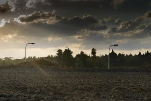 Wide angle shot of dramatic sunset with flare and godrays near Herzliya Pituah Stock Photos