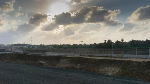 Wide angle shot of dramatic sunset with flare and godrays near Herzliya Pituah Stock Photos