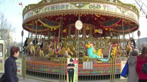 Wide angle shot of a Fairground Carousel on the South Bank of London 스톡 동영상 48598367