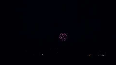 Wide Angle Shot of Fireworks Going off in the Distance Stock Footage 92454067