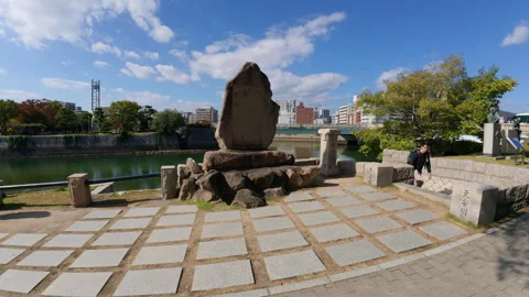 Wide angle shot of a historic monument in a public park by the Kyobashi River Stock Footage 335523341