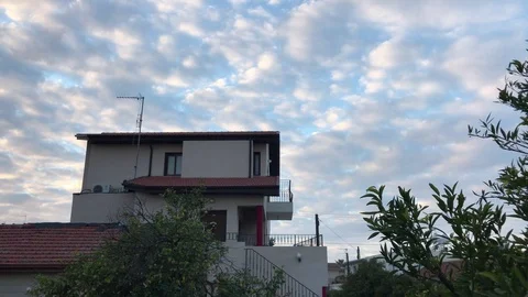 Wide Angle Shot of House against Cloudy Sky Video stock 100406357