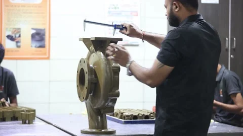 Wide angle shot of industrial casting part measuring a men, industrial safety Stock Footage 297739074