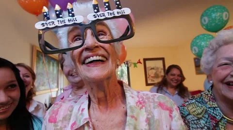Wide Angle shot Old lady with funny glasses looks and smile to camera Stock Footage 45522142