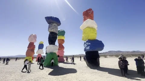 Wide Angle Shot of People at Seven Magic Mountains Nevada Desert Art Stock Footage 307657714