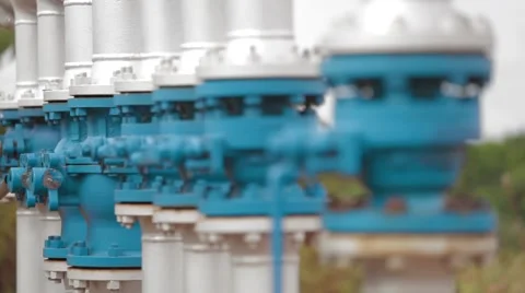 Wide Angle Shot of Pipes and Valves at an oil and gas Oil Well Stock Footage 45236731