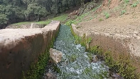 Wide Angle Shot of Pure Water Stream in an Ancient Stone Canal Stock-Footage 334345151