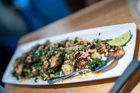 Wide angle shot with selective focus on crispy brussels sprouts at new amer.. Stock Photos