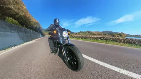 Wide-angle shot speed biker fast riding motorcycle bike on highway road Stock Footage 167919167