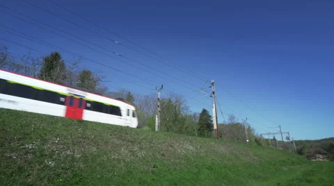 Wide angle shot of a train crossing the frame Stock Footage 49414423