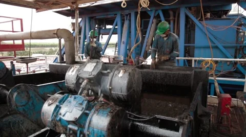 Wide Angle Shot of two oil and gas workers Stock Footage 45236445
