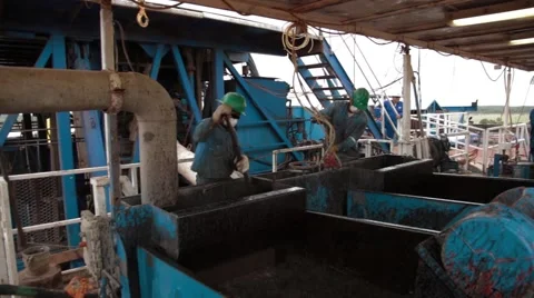 Wide Angle Shot of two oil and gas workers Stock Footage 45236478