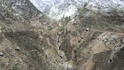 Wide angle shot of waterfall and river on mountain. huge ice snow covered mou Stock Footage 157707864