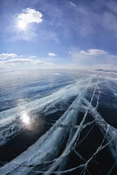 Wide angle shot of winter ice landscape on Siberian lake Baikal with dramatic Stock Photos