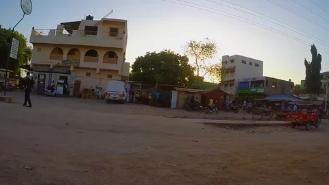 Wide-angle side-scrolling shot of an African town 2 Video stock 79020164