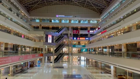Wide-angle side view of JMD Empire Square shopping mall featuring Stock Footage 283923440